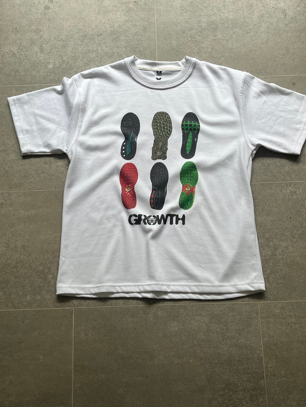 Growth Shoe Print Tee